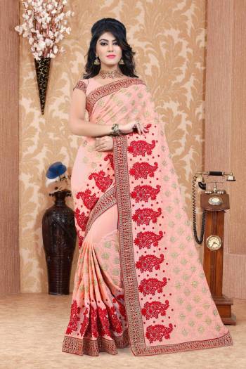 A Must Have Color In Every Womens Wardrobe Is Here With This Designer Saree In Peach Color Paired With Peach Colored Blouse. This Saree And Blouse Are Fabricated On Georgette Beautified With Heavy Jari And Thread Work All Over It. Buy This Saree Now.