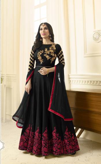 Enhance Your Beauty Wearing this Designer Floor Length Suit In Black Color Paired With Black Colored Bottom And Dupatta. Its Top Is Fabricated On Art Silk Paired With Santoon Bottom And Chiffon Dupatta. It Is Beautified With Contrasting Red Colored Embroidery. Buy This Suit Now. 