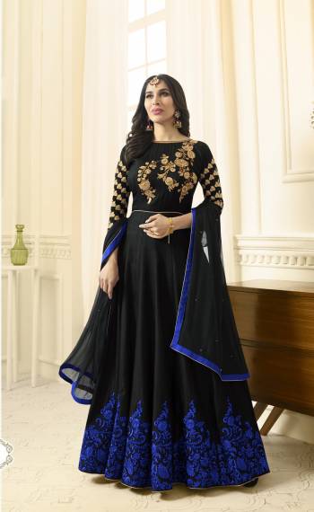 Enhance Your Beauty Wearing this Designer Floor Length Suit In Black Color Paired With Black Colored Bottom And Dupatta. Its Top Is Fabricated On Art Silk Paired With Santoon Bottom And Chiffon Dupatta. It Is Beautified With Contrasting Royal Blue Colored Embroidery. Buy This Suit Now. 