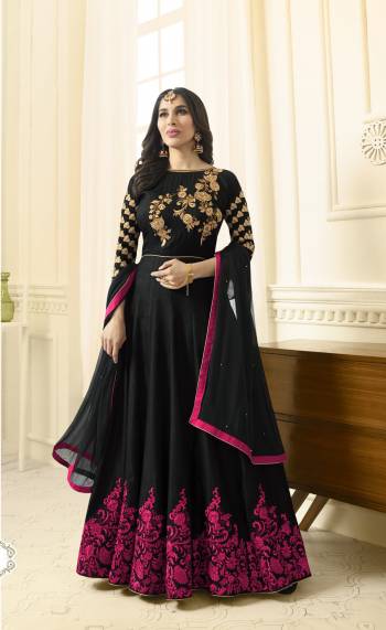 Enhance Your Beauty Wearing this Designer Floor Length Suit In Black Color Paired With Black Colored Bottom And Dupatta. Its Top Is Fabricated On Art Silk Paired With Santoon Bottom And Chiffon Dupatta. It Is Beautified With Contrasting Dark Pink Colored Embroidery. Buy This Suit Now. 