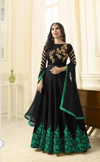 Enhance Your Beauty Wearing this Designer Floor Length Suit In Black Color Paired With Black Colored Bottom And Dupatta. Its Top Is Fabricated On Art Silk Paired With Santoon Bottom And Chiffon Dupatta. It Is Beautified With Contrasting Sea Green Colored Embroidery. Buy This Suit Now. 