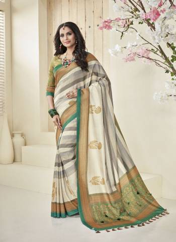 Simple And Elegant Looking Saree Is Here In Cream Color Paired With Light Green Colored Blouse. This Saree And Blouse Are Fabricated On Cotton Khadi Beautified With Printed Motifs.