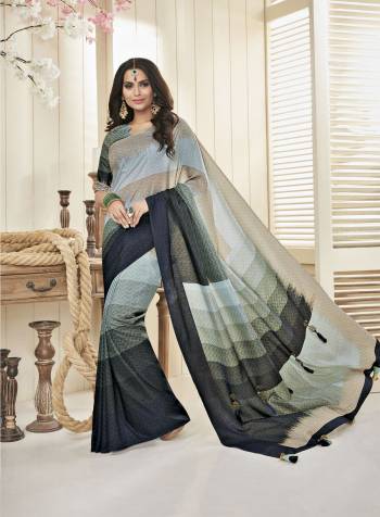 Here Is A Beautiful Rich Looking Saree In Grey Color Paired With Grey Colored Blouse. This Saree And Blouse Are Fabricated On Cotton Khadi Beautified With Intricate Prints All Over It.