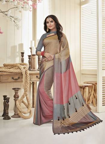 You Will Definitely Earn Lots Of Compliments Wearing This Saree In Beige And Pink Color Paired With Contrasting Grey Colored Blouse, This Saree And Blouse are Fabricated On Cotton Khadi. Its Lovely Color Block Pattern Will Earn You Lots Of Compliments From Onlookers.