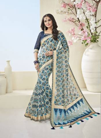 Celebrate This Festive Season With Beauty And Comfort Wearing This Saree In Blue And Cream Color Paired With Blue Colored Blouse. This Saree And Blouse are Fabricated On Cotton Khadi Beautified With Geomteric Prints All Over. Buy This Saree Now.