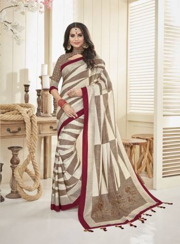 Rich And Elegant Looking Saree Is Here In Cream And Light Brown Color Paired With Light Brown Colored Blouse. This sAree And Blouse are Fabricated On Cotton Khadi Beautified With Simple Prints All Over. Its Color And Fabric Will Give Your Personality A Rich Look Like Never Before. 