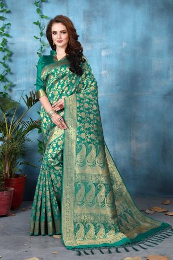 Add This Pretty Shade To Your Wardrobe Wearing This Saree In Teal Blue Color Paired With Teal Blue Colored Blouse. This Saree And Blouse Are Fabricated On Banarasi Art Silk Beautified With Weave All Over The Saree. Buy This Pretty Saree Now.