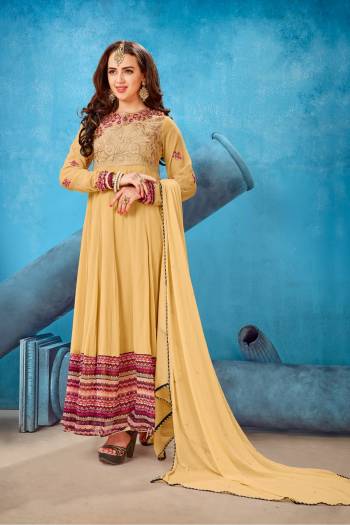 Get Ready For The Upcoming Festive Season With This Designer Suit In Beige Color Paired With Beige Colored Bottom And Dupatta. Its Top Is Fabricated On Georgette Paired With Santoon Bottom And Chiffon Dupatta. It Has Beautiful Embroidery Over The Yoke And Sleeves.