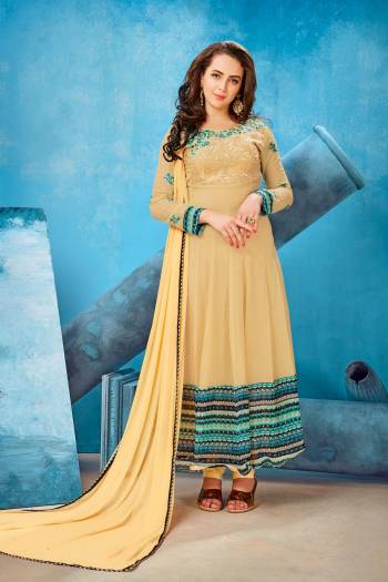 Get Ready For The Upcoming Festive Season With This Designer Suit In Beige Color Paired With Beige Colored Bottom And Dupatta. Its Top Is Fabricated On Georgette Paired With Santoon Bottom And Chiffon Dupatta. It Has Beautiful Embroidery Over The Yoke And Sleeves.