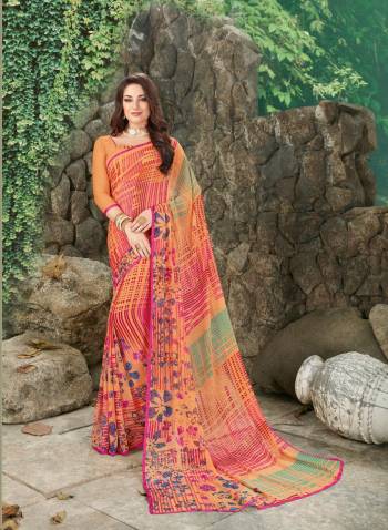 Look Attractive In This Light Orange Colored Saree Paired With Light Orange Colored Blouse. This Saree And Blouse Are Fabricated On Georgette Beautified With Multi Colored Prints All Over It. 