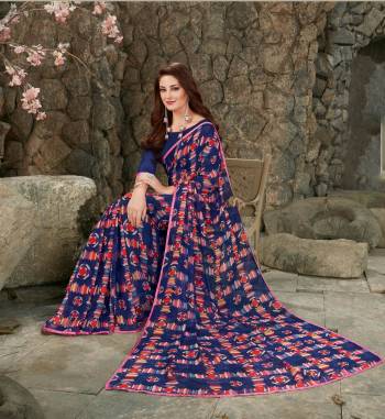 Enhance Your Personality Wearing This Printed Saree In Navy Blue Color Paired With Navy Blue Colored Blouse. This Saree And Blouse are Fabricated On Georgette Beautfied With Geomteric Prints. 