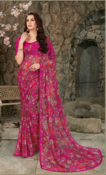 Dark Colors Gives An Attractive Look To Your Personality, So Grab This Pretty Saree In Magenta Pink Color Paired With Magenta Pink Colored Blouse. This Saree And Blouse Are Fabricated On Georgette Beautified With Prints. 