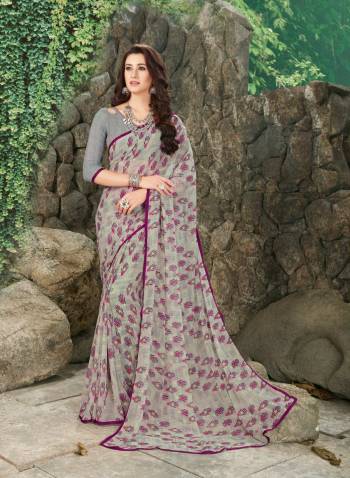 Flaunt Your Rich And Elegant Taste Wearing This Saree In Pale Grey Color Paired With Pale Grey Colored Blouse. This Saree And Blouse Are Fabricated On Georgette Beautified With Small Prints. Buy Now.