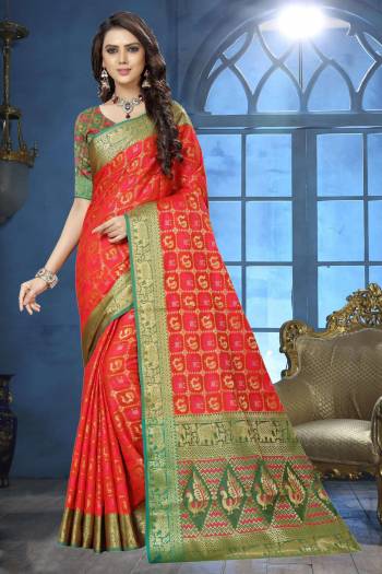 Shine Bright Wearing This Designer Silk Saree In Orange Color Paired With Contrasting Green Colored Blouse. This Saree Is Fabricated On Jacquard Silk Paired With Art Silk Fabricated Blouse Beautified With Weave. 