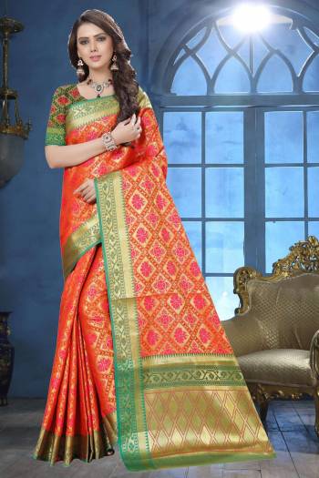 Shine Bright Wearing This Designer Silk Saree In Orange Color Paired With Contrasting Dark Green Colored Blouse. This Saree Is Fabricated On Jacquard Silk Paired With Art Silk Fabricated Blouse Beautified With Weave. 