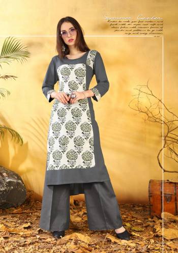 For Your Daily Wear, Grab This Beautiful Readymade Kurti In Grey And White Color Fabricated On Rayon Beautified With Bold Prints. 