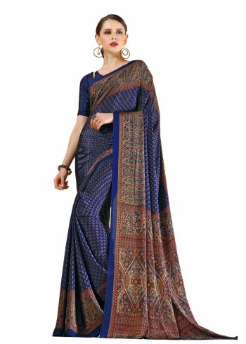 Enhance Your Personality Wearing This Saree In Navy Blue Color Paired With Navy Blue Colored Blouse. This Saree And Blouse are Fabricated On Crepe Beautified With Intricate Prints All Over.