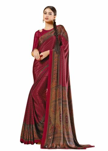 For A Royal Look, Grab This Pretty Saree In Maroon Color Paired With Maroon Colored Blouse. This Saree And Blouse Are Fabricated On Crepe Beautified With Prints all Over It.