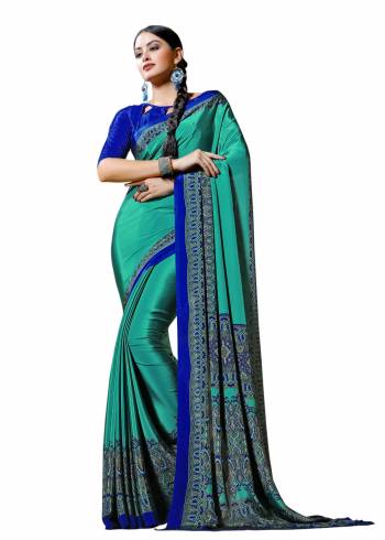 Look Attractive Wearing This Lovely Saree In sea Green Color Paired With Contrasting Royal Blue Colored Blouse. This Saree And Blouse Are Fabricated On Crepe Beautified With Prints All Over It. Buy This Elegant Saree Now.