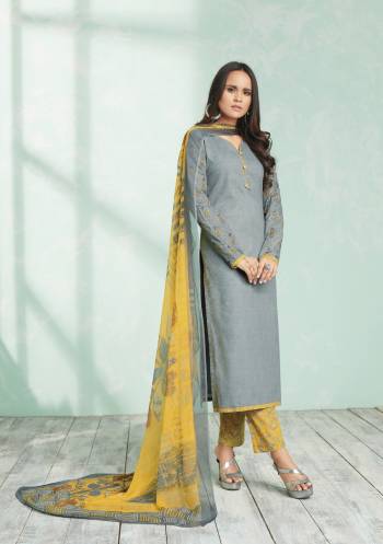 A Very Pretty Color Pallete Is Here With This Lovely Combination In Grey Colored Top Paired With Contrasting Yellow Colored Bottom And Dupatta. Its Top And Bottom Are Fabricated On Cotton Paired With Chiffon Dupatta. Buy This Suit Now.