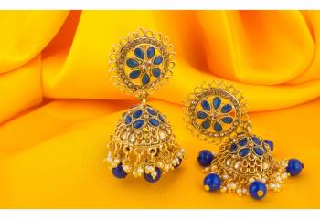 Enhance The Look of Your Simple Kurti Pairing It Up With This Beautiful Pair Of Earrings In Golden And Blue Color. Buy Now.