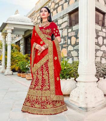 Adorn The Beautiful Angelic Look Wearing This Designer Lehenga choli In Red Color Paired With Red Colored Dupatta. Its Blouse And Lehenga Are Fabricated On Velvet Paired With Net Fabricated Dupatta. This Lehenga Choli Is Beautified With Heavy Jari And Thread Work All Over It. Buy This Now And You Will Definitely Earn Lots Of Compliments Wsaring This Lehenga Choli.