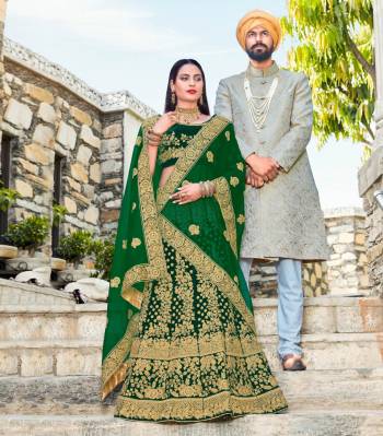 Add This New Color In Lehenga Choli To Your Wardrobe With This Heavy Designer Lehenga Choli In Pine Green Color Paired With Green Colored Dupatta. Its Blouse And Lehenga Are Fabricated On Velvet Paired With Net Fabricated Dupatta. It Is Beautified With Heavy Embroidery All Over It. Buy It Now.