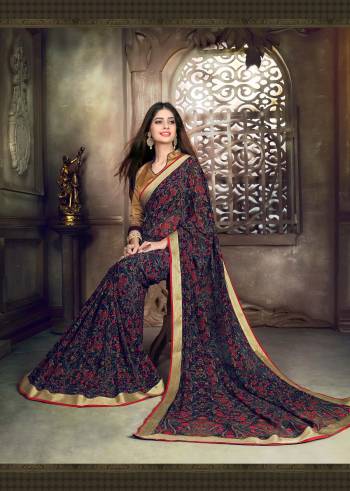 Prints Are Always Attractive Be It Bold Or Intricate. Grab This Beautiful Saree In Navy Blue Color Paired With Golden Colored Blouse. This Saree Is Fabricated On Georgette Paired With Art Silk Fabricated Blouse. It Is Beautified With Intricate Floral Prints All Over It. Buy Now.