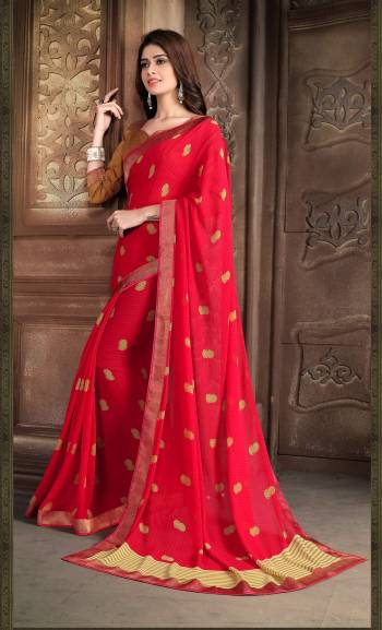 Adorn The Pretty Angelic Look Wearing This Saree In Red Color Paired With Copper Colored Blouse. This Saree Is Fabricated On Georgette Paired With Art Silk Fabricated Blouse. Buy This Saree Now.