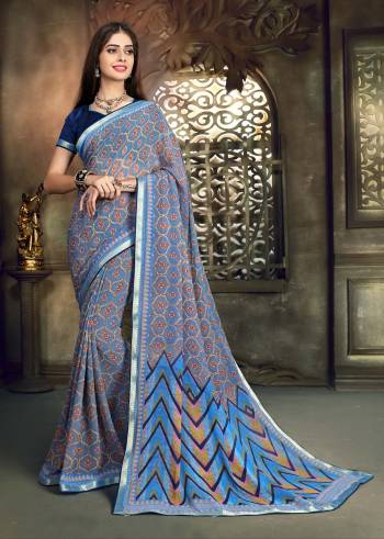 Look Pretty In This All over Printed Saree In Blue Color Paired With Navy Blue Colored Blouse. This Saree Is Fabricated On Georgette Paired With Art Silk Fabricated Blouse. This Saree Is Light Weight, Easy To Drape And Durable.