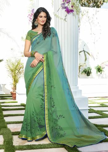 Summer Is About Light And Soft Shades. So Grab This Pretty Saree In Light Blue And Light Green Color Paired With Light Green colored Blouse. This Saree Is Fabricated On Chiffon Paired With Brocade Fabricated Blouse. Buy This Saree Now.