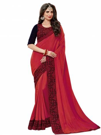 Adorn The Pretty Angelic Look Wearing This Saree In Red Color Paired With Contrasting Navy Blue Colored Blouse. This Saree Is Fabricated On Satin Silk Paired With Velvet Fabricated Blouse. It Is Beautified With Thread Embroidery And Stone Work .