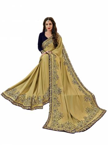 Flaunt Your Rich and Elegant Taste Wearing This Designer Saree In Cream Color Paired With Contrasting Navy Blue Colored Blouse. This Saree Is Fabricated On Satin Silk Paired With Velvet Fabricated Blouse. It Has Heavy Embroidery And Also Its Fabric Is Light Weight And easy To carry.