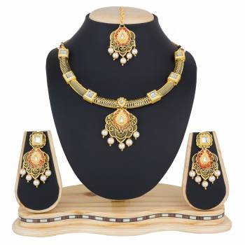 You Will Definitely Earn Lots Of Compliments Wearing This Designer And Elegant Looking Necklace Set In Golden Color Beautified With White Colored Stones. Buy This Rich Looking Necklace Set Now.