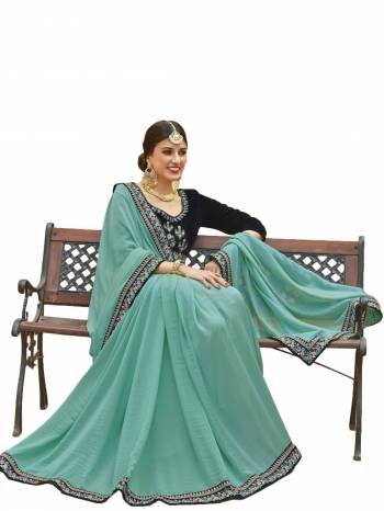 This Pretty Designer Saree Will Definitely Earn You Lots Of Compliments From Onlookers. Grab This Beautiful Turquoise Blue Colored Saree Paired With Navy Blue Colored Blouse. This Saree Is Fabricated On Soft Silk Paired With Velvet Fabricated Blouse. It HAs Multi Colored Embroidery Over The Blouse And Saree Lace Border.