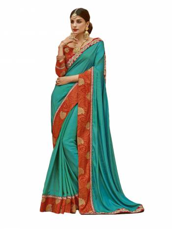 New And Unique Shade In Blue Is Here With This Designer Saree In Teal Blue Color Paired With Contrasting Orange Colored Blouse. This Saree Is Fabricated On Art Silk Paired With Jacquard Silk Fabricated Blouse. This Light Weight, Durable And Easy To Care For.