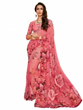 Look Pretty In Pink Wearing This Printed Saree In Pink Color Paired With Pink Colored Blouse, This Saree And Blouse Are Fabricated On Georgette Beautified With Bold Floral Prints All Over The Saree And Blouse. Buy It Now.