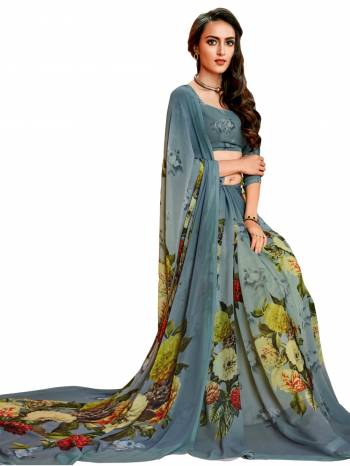 You Will Definitely Earn Lots Of Compliments Wearing this Saree In Grey Color Paired With Grey Colored Blouse, This Saree And Blouse are Fabricated On Georgette Beautified with Bold Floral Prints Over The Saree And Blouse. Buy It Soon Before The Stock Ends.