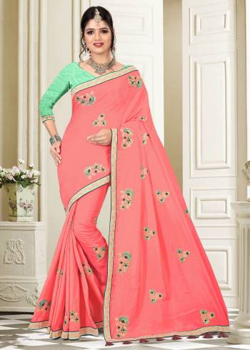 Add This Lovely Shade To Your Wardrobe In Dark Peach Colored Saree Paired With Contrasting Light Green Colored Blouse, This Saree Is Fabricated On Silk Paired With Art Silk Fabricated Blouse. It Is Beautified With Embroidered Motifs And Lace Border. Buy This Designer Saree Now.