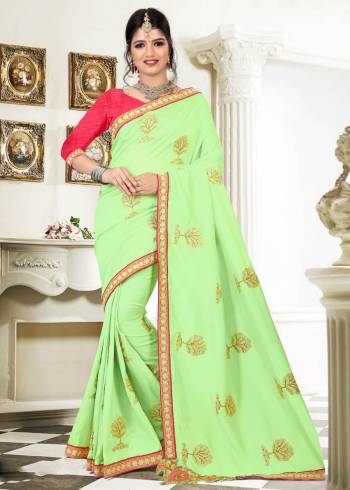 Simple, Rich and Elegant Looking Designer Saree Is Here In Light Green Color Paired With Contrasting Dark Pink Colored Blouse. This Saree Is fabricated On Silk Paired With Art Silk Fabricated Blouse. It Is Beautified With Embroidered Motifs All Over. Buy Now.