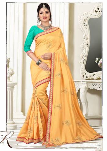 For A Proper Traditional Look, Grab This designer Saree In Yellow Color Paired With Contrasting Turquoise Blue Colored Blouse. This Saree Is Fabricated On Silk Paired With Art Silk Fabricated Blouse. Pait This Up Traditional Accessories And Complete The Look.