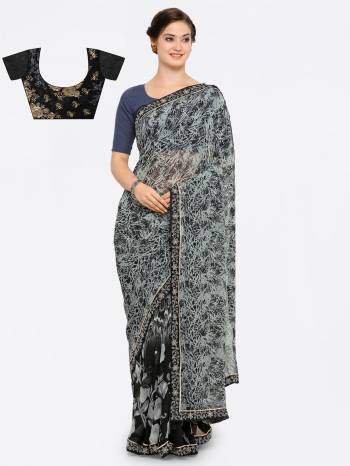 Enhance your Beauty Wearing This Saree In Grey And Black Color Paired With Black Colored Blouse. This Saree Is Fabricated On Georgette Paired With Art Silk Fabricated Blouse. It Is Beautified With Prints all Over The Saree And Embroidery Over The Blouse. 