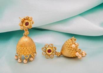 Grab This Lovely Jhumka Styled Earrings Set In Golden Color Beautified With stone And Pearls. It Is Light Weight And Easy To Carry Throughout The Gala. Buy Now.