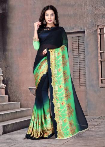 Enhance Your Personality Wearing This Saree In Navy Blue Color Paired With Navy Blue Colored Blouse. This Saree And Blouse Are Fabricated On Satin Silk Beautified with Prints Over The Saree Border.