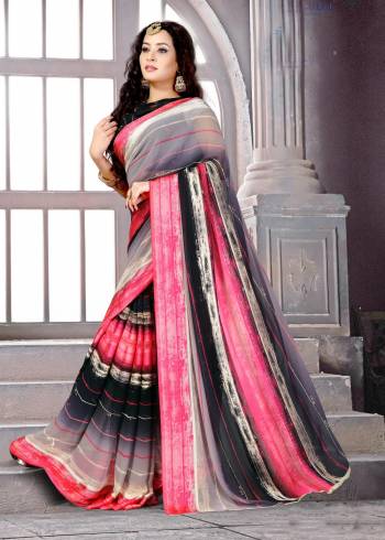 Add This Pretty Saree To Your Wardrobe In Grey And Pink Color Paired With Black Colored Blouse. This Saree And Blouse Are Fabricated On Satin Silk Beautified With Simple Lining Prints All Over. This Saree Is Light Weight And Easy To Carry All Day Long.