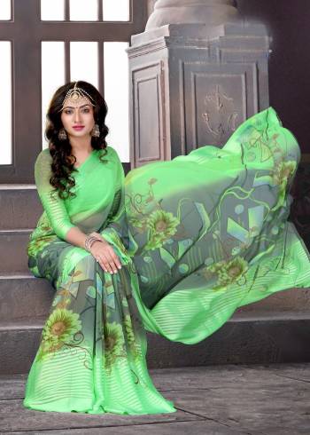 Here Is A Pretty Saree In Green And Grey Color Paired With Green Colored Blouse. This Saree And Blouse Are Fabricated On Satin Silk Beautified With Bold Prints All Over. It Is Light Weight And Easy To Carry All Day Long.