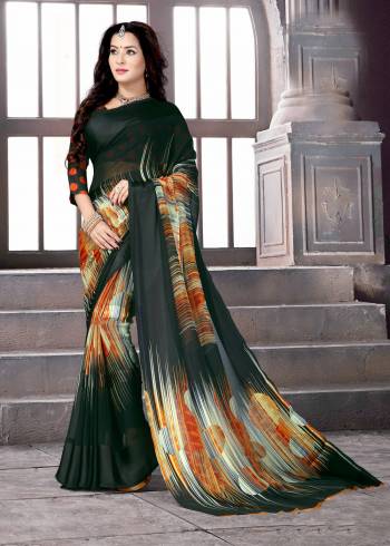 Here Is Lovely And Attractive Shade In Green With This Saree In Dark Green Color Paired With Dark Green Colored Blouse. This saree And Blouse Are Fabricated On Satin Silk. It Is Light Weight, Durable and Easy To care For.