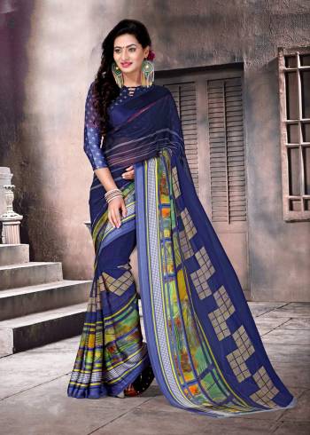 For Your Casual wear, Grab This Simple Saree In Dark Blue Color Paired With Dark Blue Colored Blouse. This Saree And Blouse are Fabricated On Satin Silk Beautified With Prints. Buy This Saree Now.