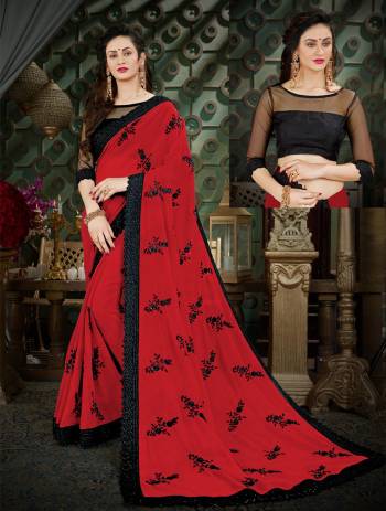 Adorn The Lovely Angelic Look Wearing This Saree In Red Color Paired With Black Colored Blouse. This Saree Is Fabricated On Georgette Paired With Art Silk Fabricated Blouse. It Has Attractive Embroidery and Also Ensures Superb Comfort All Day Long. 