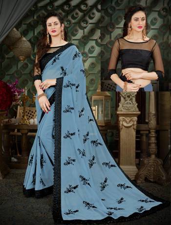 Lovely Shade In Blue Is Here With This Saree In Baby Blue Color Paired With Black Colored Blouse. This Saree Is Fabricated On Georgette Paired With Art Silk Fabricated Blouse. This New and Unique Shade Will earn You Lots Of Compliments From Onlookers. Buy Now.